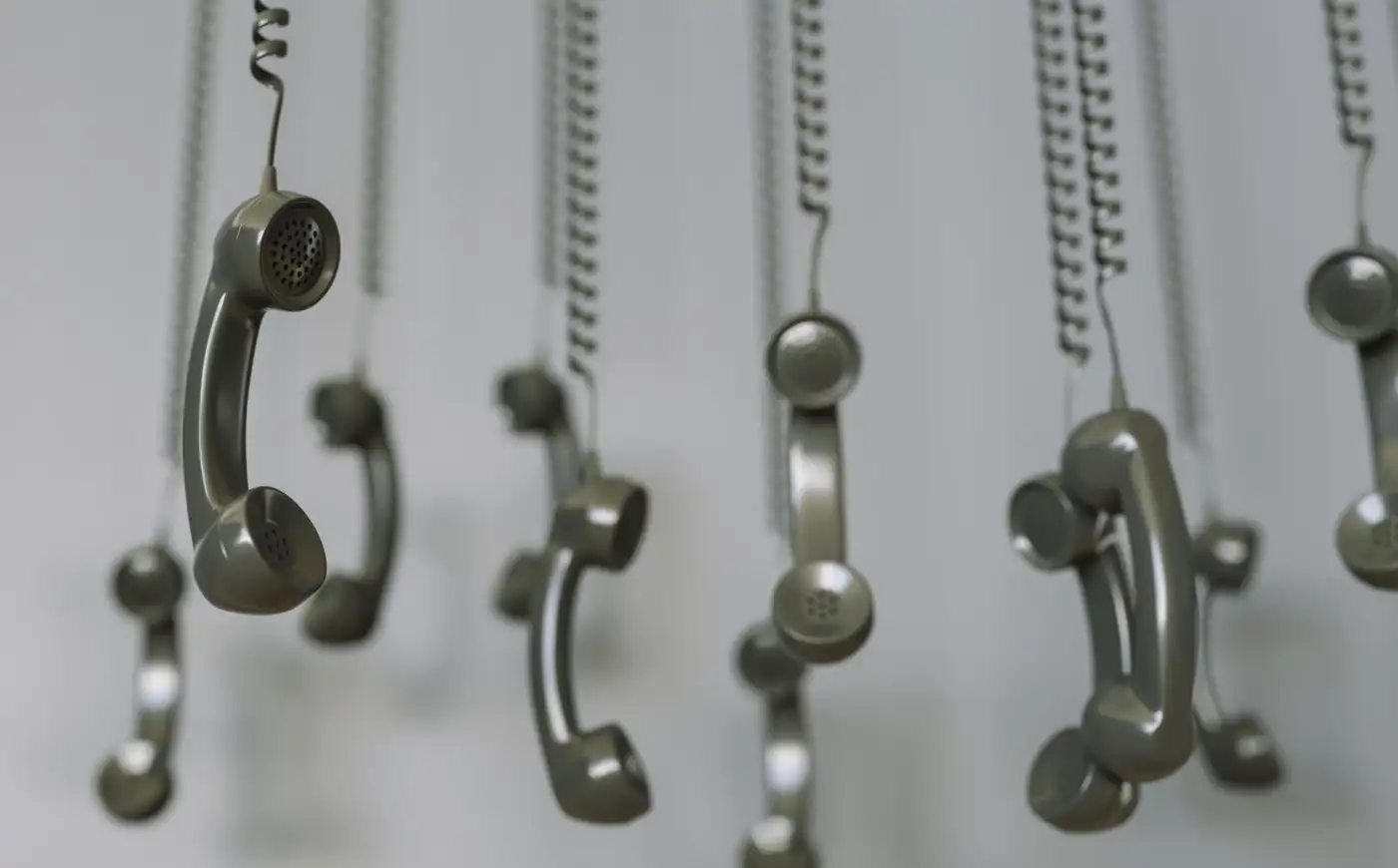 A row of payphone handsets