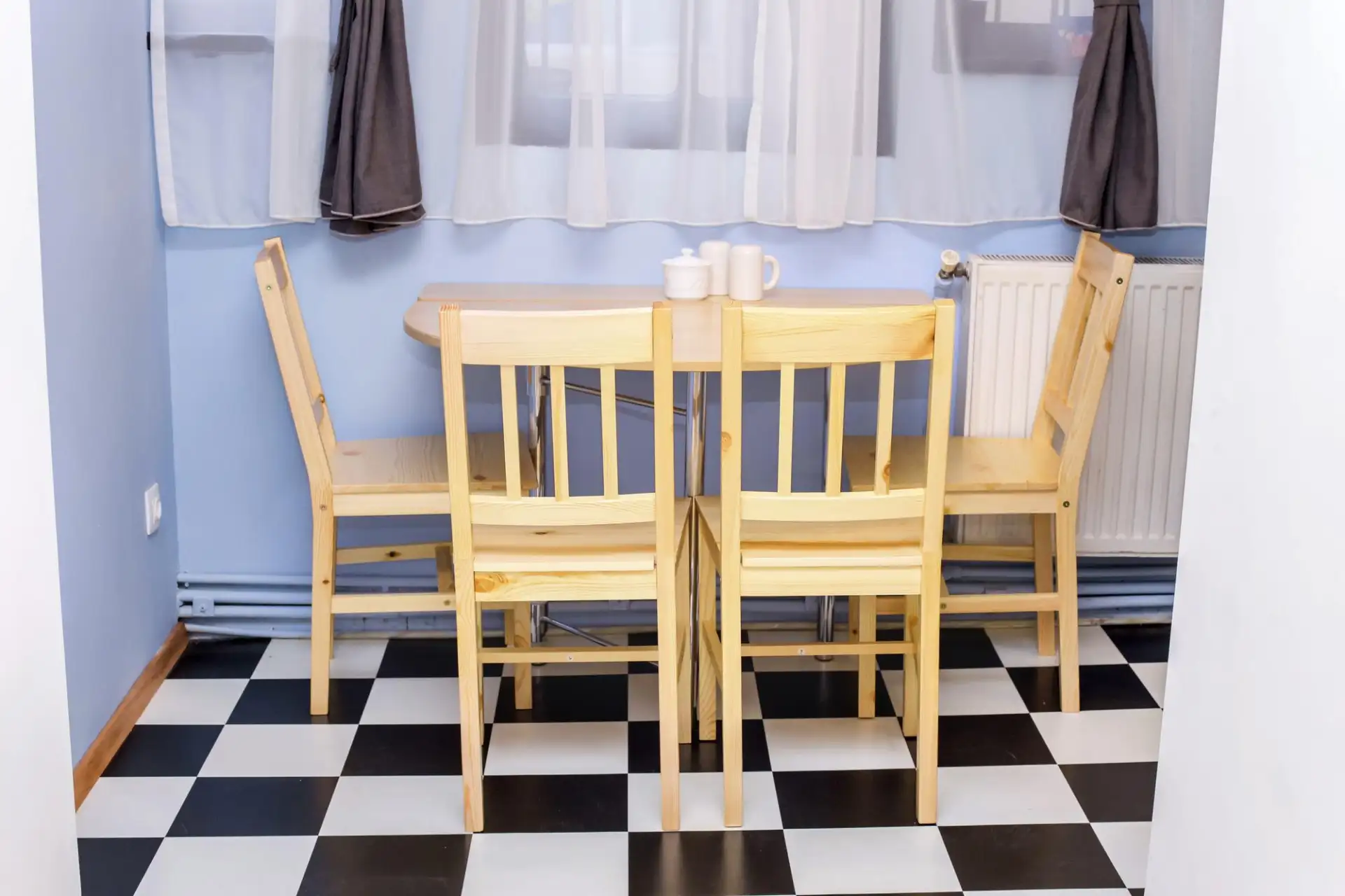 An empty chair at a kitchen table in the early evening