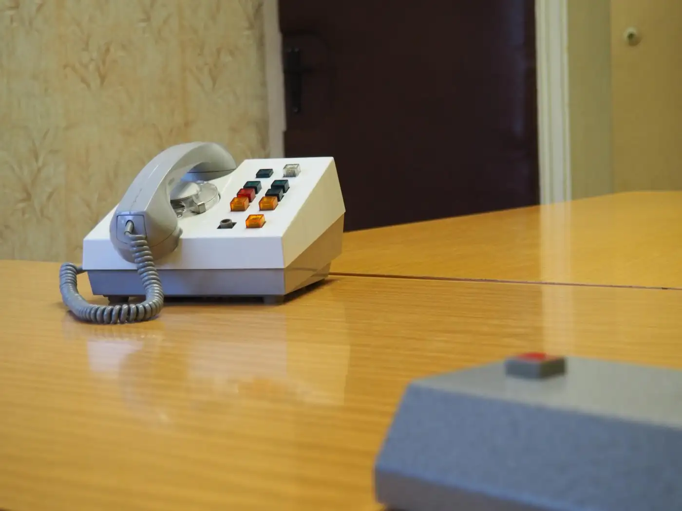 A landline telephone on a hallway table