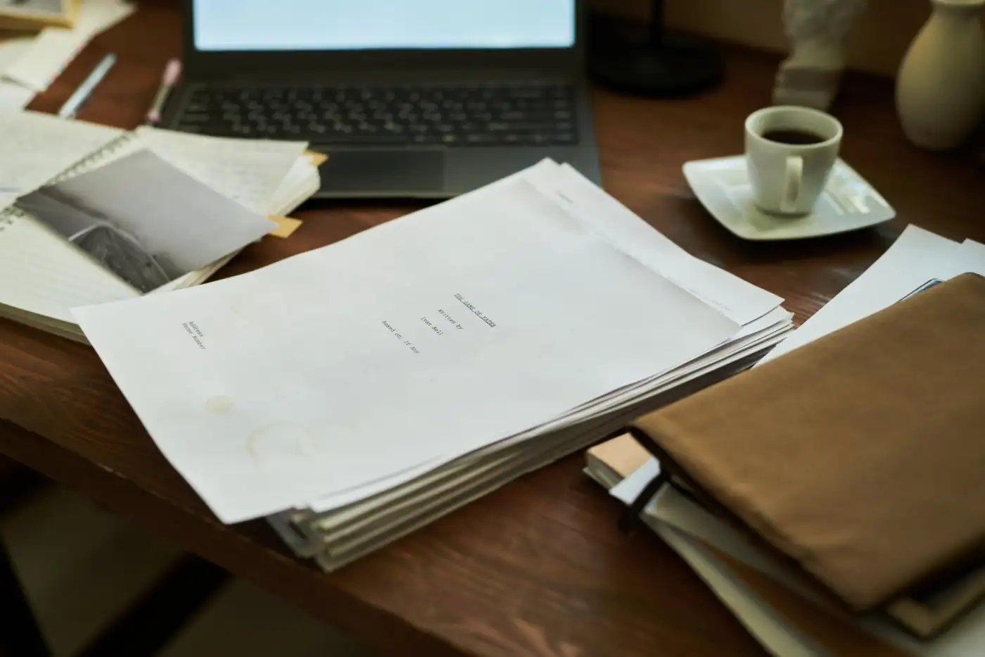 A stack of letters and paperwork on a desk